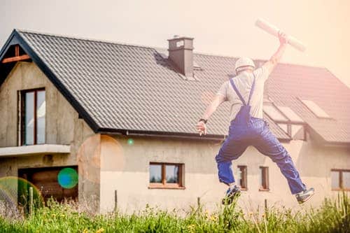 happy construction worker after using construction bookkeeping